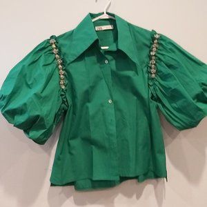 Green puff style short sleeved blouse with jewel detail